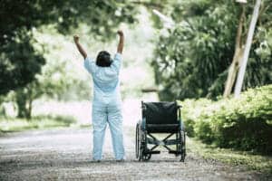 physical therapy senior woman with wheelchair in the park - W przygotowaniu szczegółowe opracowanie